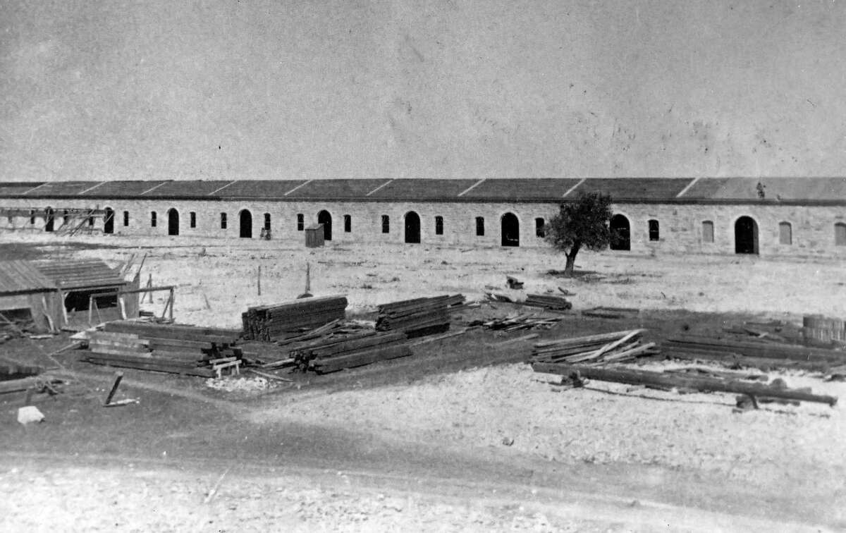 The Quadrangle at Fort Sam Houston — shown here under construction circa 1879 — was less than a decade old when Army Capt. Bainbridge Reynolds was assigned to the post.