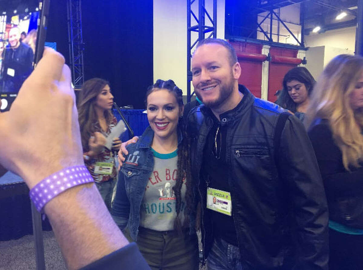 FILE - Houston sports radio host Adam Clanton and actress Alyssa Milano pose for a photograph during a Super Bowl LI promotional event in Houston, Texas. Monday, Clanton and Sports Talk 790 parted ways.