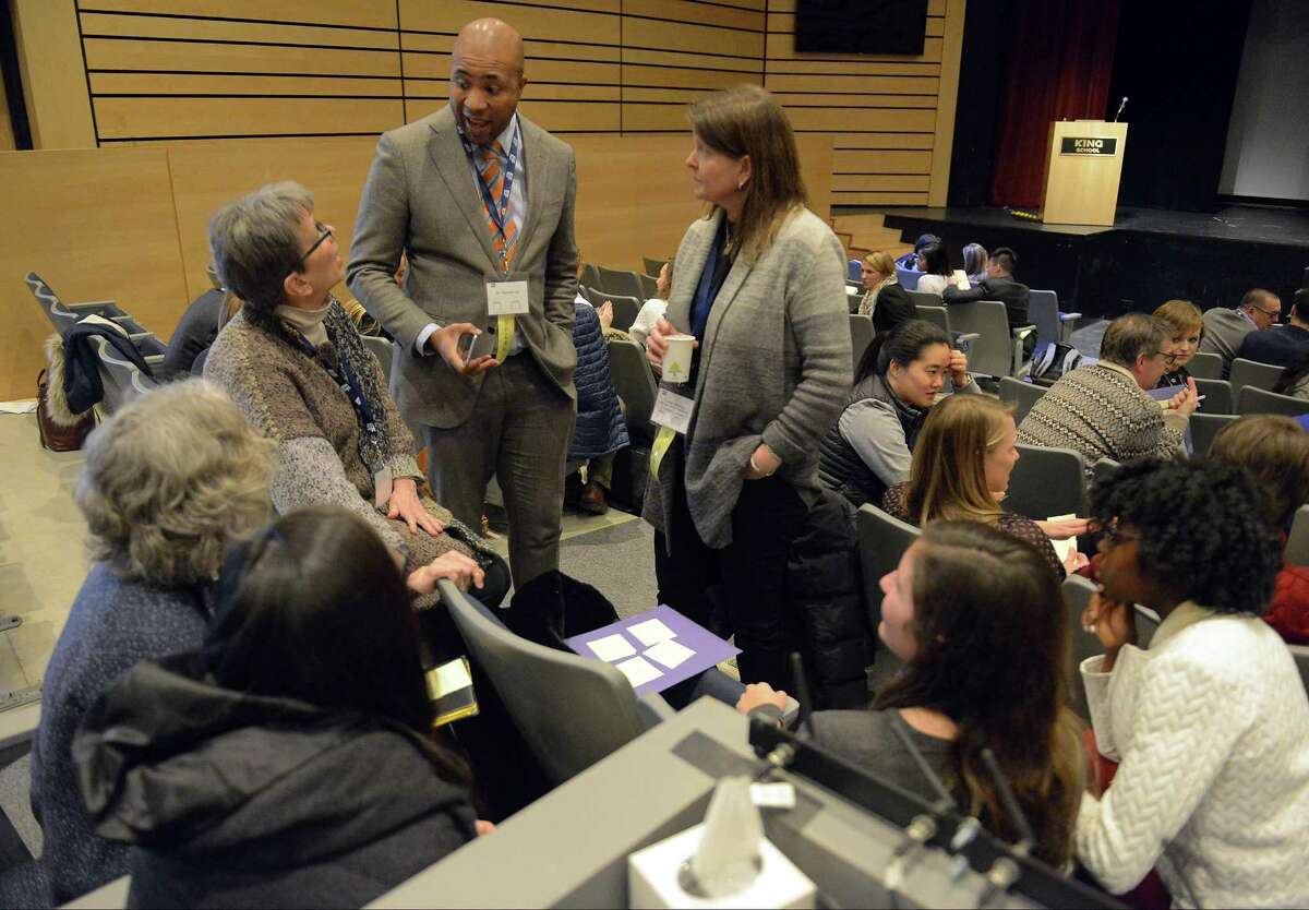 Dr. Derrick Gay, center, talks with educators participating in a breakout session during the Global Education Leadership Symposium at King School in Stamford on Feb. 4, 2017. Gay, an internationally recognized consultant to educational, artistic and philanthropic organizations around the world, was the event's keynote speaker.