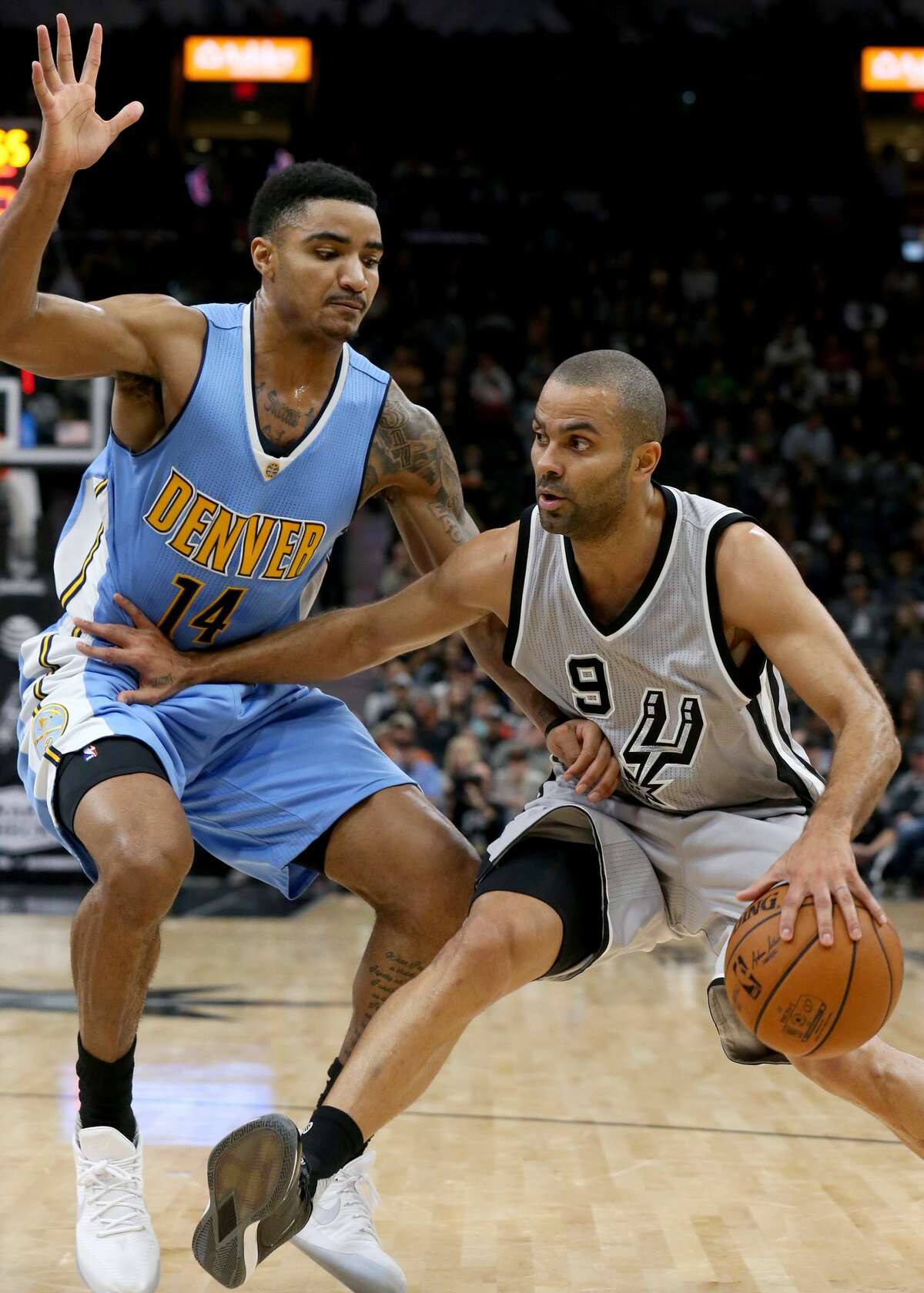 San Antonio Spurs' Tony Parker look for room around Denver Nuggets?• Gary Harris during first half action Saturday Feb. 4, 2017 at the AT&T Center.