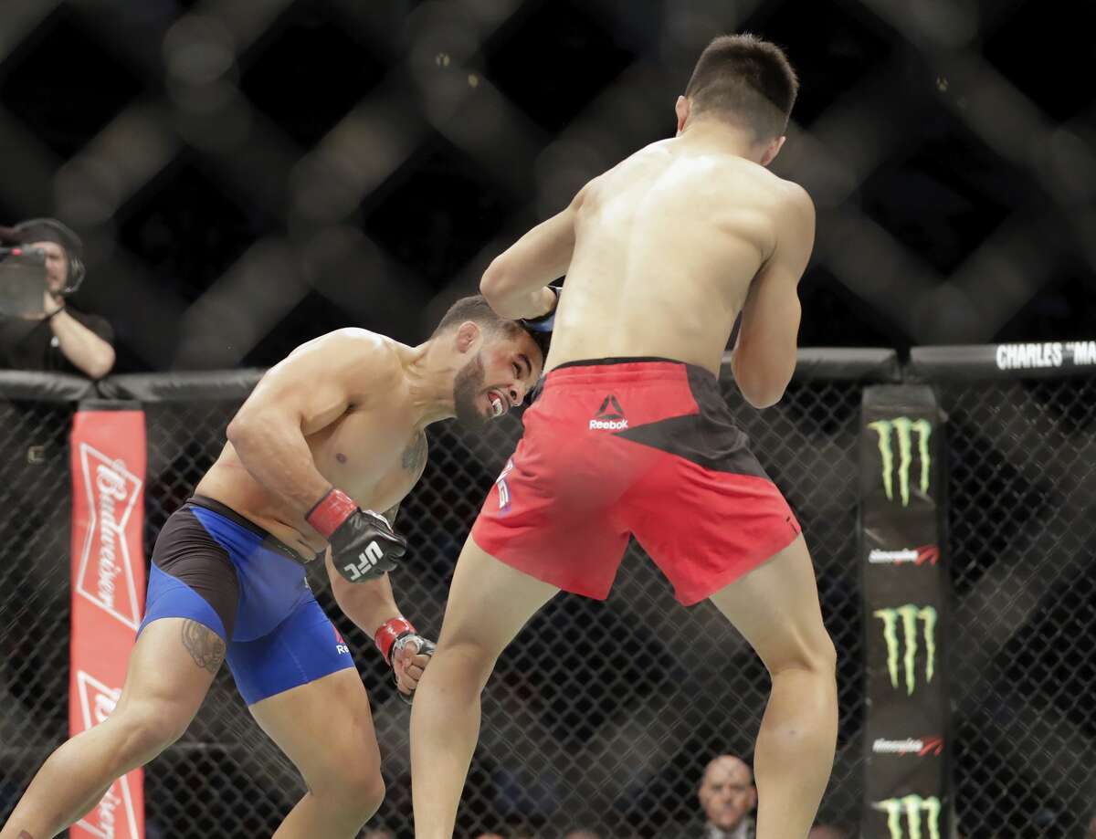HOUSTON, TX - FEBRUARY 04: Chan Sung Jung of South Korea fights Dennis Bermudez in the first round of their featherweight bout during the UFC Fight Night event at the Toyota Center on February 4, 2017 in Houston, Texas. (Photo by Tim Warner/Getty Images)