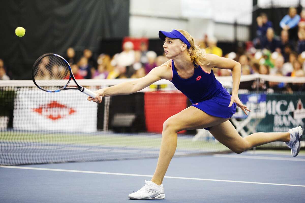 Naomi Broady attempts to return a shot from Tatjana Maria during the women's championship singles match during the Dow Tennis Classic at the Greater Midland Tennis Center on Sunday.