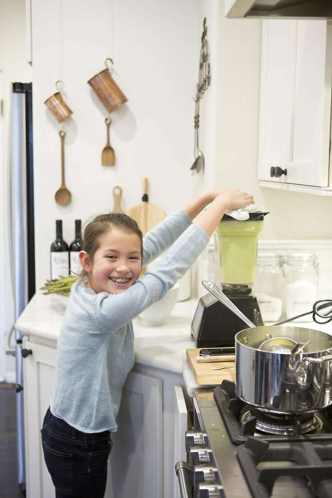 Wiebke Liu’s daughter Josie helps mom prepare lunch with one of Liu’s mixes that she creates from scratch. Photo: Vivian Johnson, Special To The Chronicle