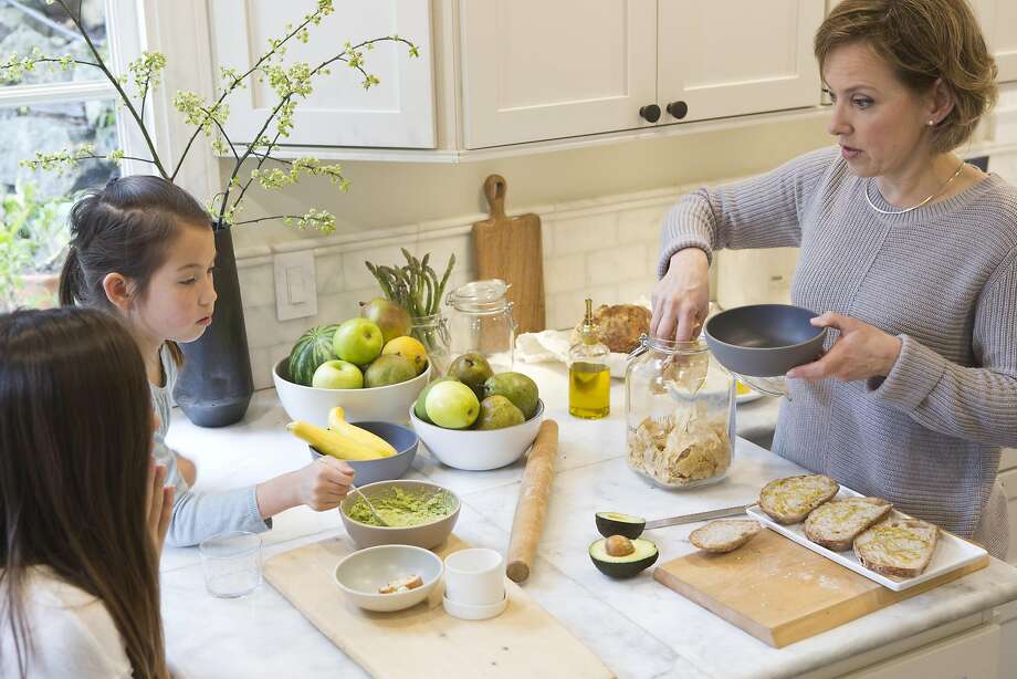 Wiebke Liu and her daughters Mia and Josie prepare lunch with Liu’s mixes that she creates from scratch. Photo: Vivian Johnson, Special To The Chronicle