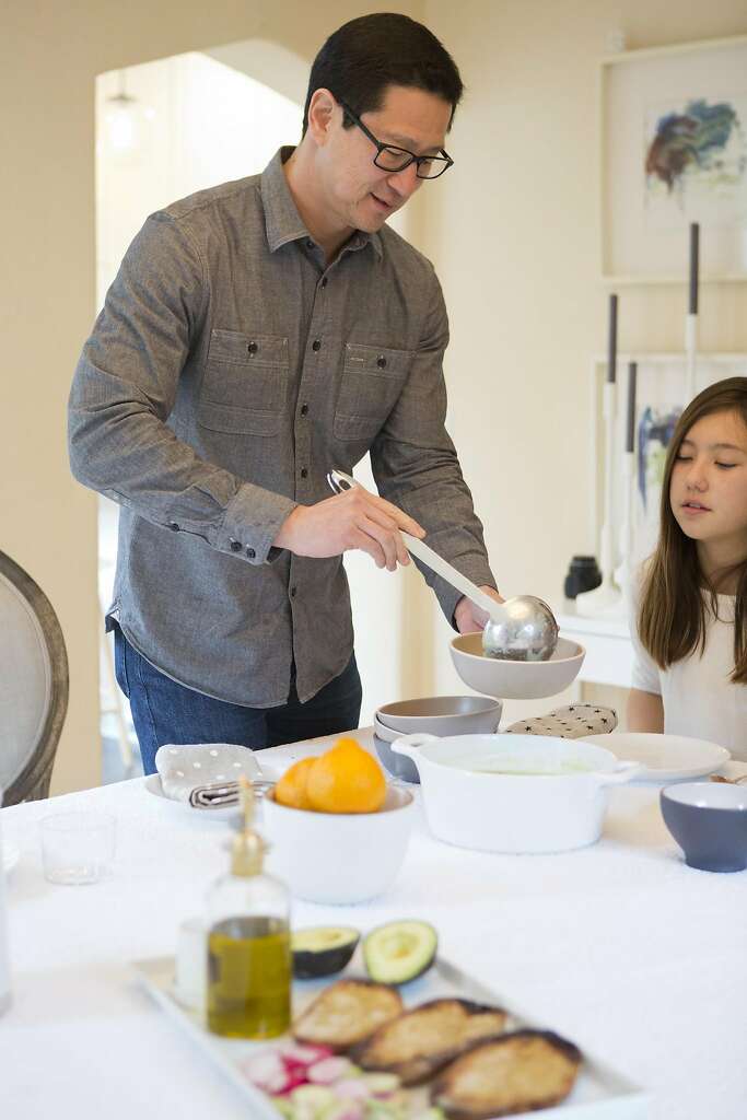 Wiebke Liu’s husband, Fred, dishes up soup made by his daughters from a mix Liu created from scratch. Photo: Vivian Johnson, Special To The Chronicle