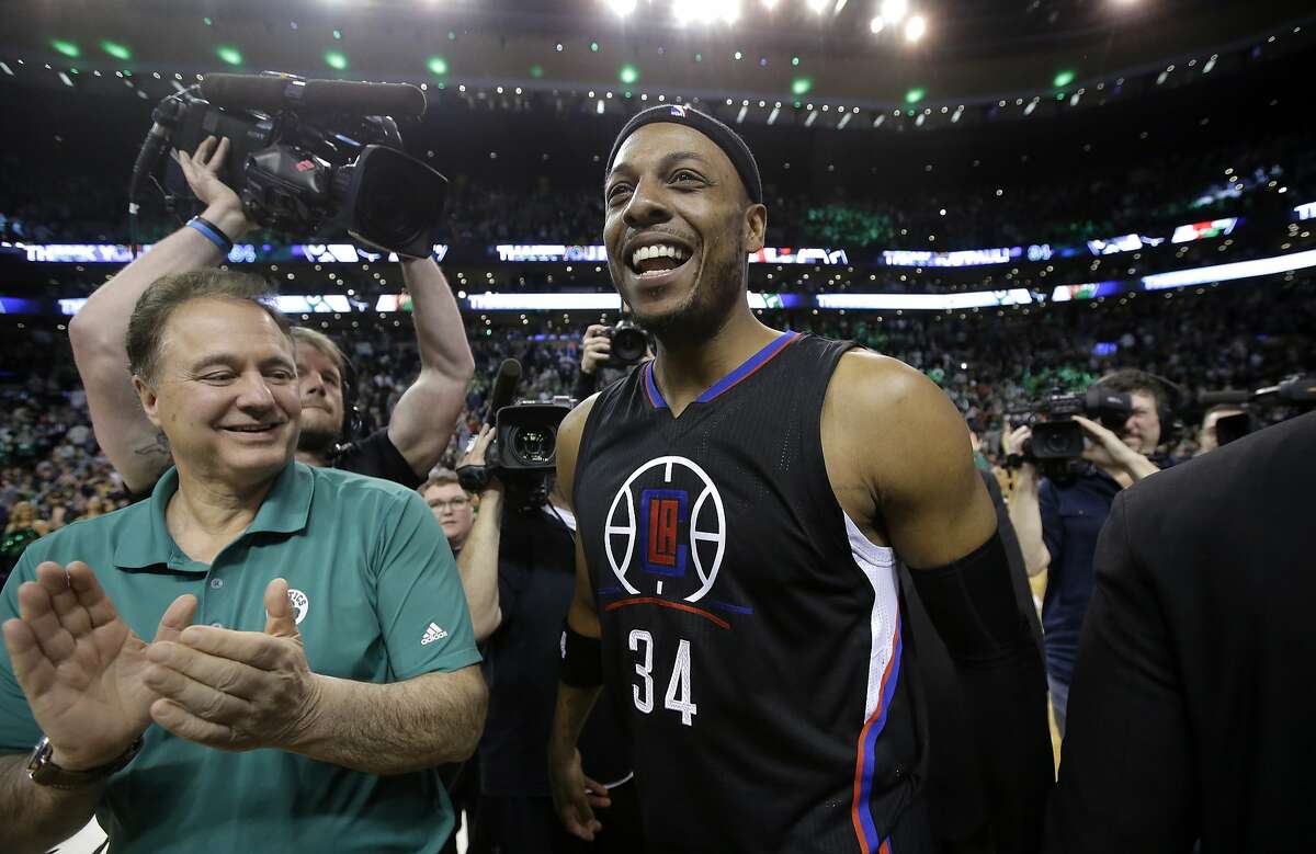Los Angeles Clippers forward Paul Pierce (34) walks on the court with Boston Celtics co-owner Steve Pagliuca, left, following an NBA basketball game against the Celtics, Sunday, Feb. 5, 2017, in Boston.