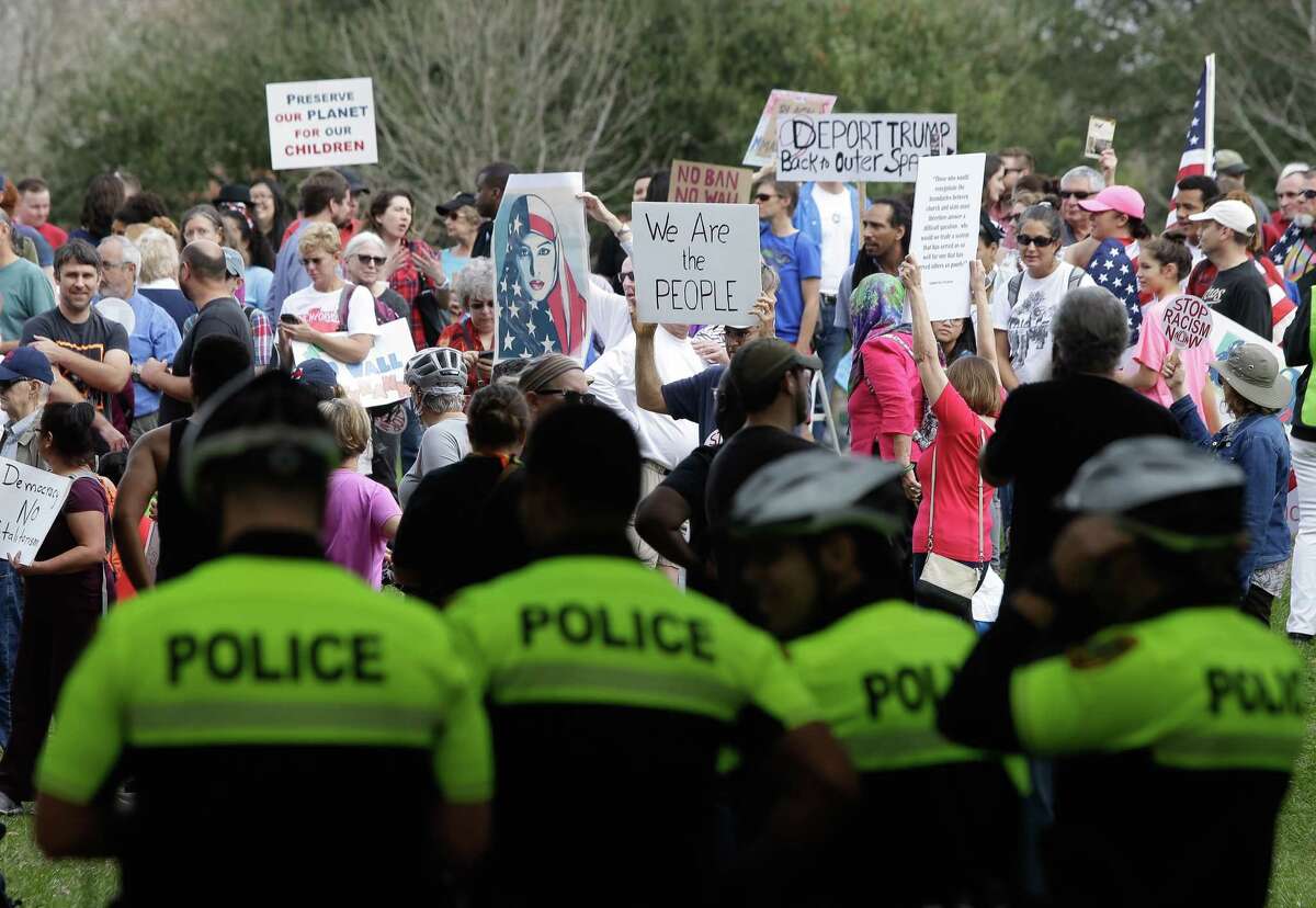 A group bicycle police officers stand by as protesters gather at Hermann Park for a march towards the Super Bowl Sunday, Feb., 5, 2017. ( Melissa Phillip / Houston Chronicle )