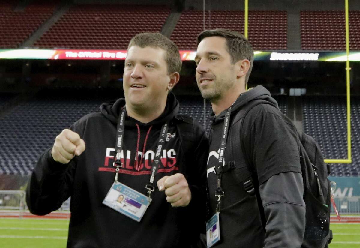 HOUSTON, TX - FEBRUARY 04: Offensive Coordinator Kyle Shanahan talks with a staff member during the Super Bowl LI team walk through at NRG Stadium on February 4, 2017 in Houston, Texas. (Photo by Tim Warner/Getty Images)