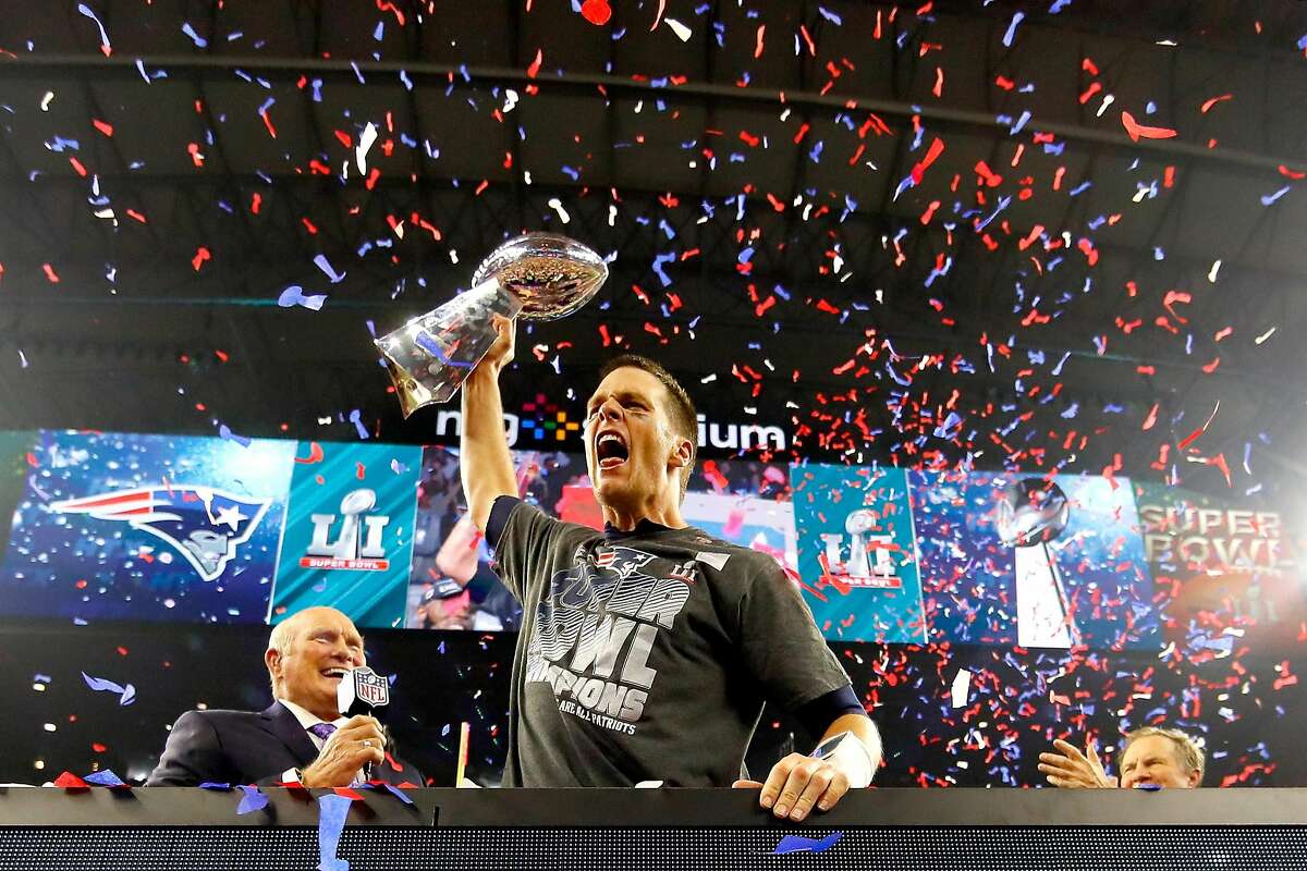 HOUSTON, TX - FEBRUARY 05: Tom Brady #12 of the New England Patriots celebreates with the Vince Lombardi Trophy after defeating the Atlanta Falcons during Super Bowl 51 at NRG Stadium on February 5, 2017 in Houston, Texas. The Patriots defeated the Falcons 34-28. (Photo by Kevin C. Cox/Getty Images)