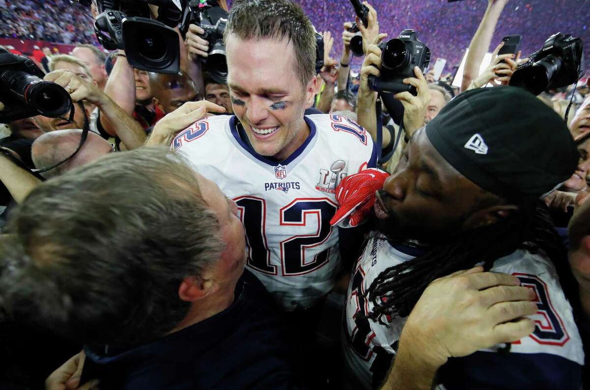 HOUSTON, TX - FEBRUARY 05: Head coach Bill Belichick, Tom Brady #12 and LeGarrette Blount #29 of the New England Patriots celebrate after defeating the Atlanta Falcons during Super Bowl 51 at NRG Stadium on February 5, 2017 in Houston, Texas. The Patriots defeated the Falcons 34-28. (Photo by Kevin C. Cox/Getty Images)