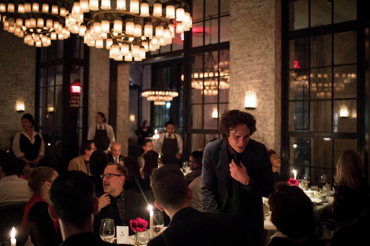 -- PHOTO MOVED IN ADVANCE AND NOT FOR USE - ONLINE OR IN PRINT - BEFORE FEB. 5, 2017. -- Jay Fielden, the new editor in chief of Esquire magazine, speaks with guests during the Esquire dinner at Le Coucou in New York, Nov. 30, 2017. Fielden has been charged with helping Esquire magazine, long the man’s bible, as it charts a new course in an era of transgender bathrooms and pink hats. (Hilary Swift/The New York Times)