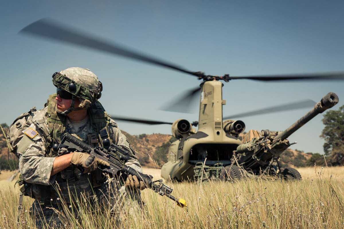 In this file photo, Second Lt. Alex Joyce, Bravo Battery, 1-143rd Field Artillery, pulls landing-zone security during an air assault operation at Fort Hunter Liggett, Calif., June 15, 2015. A blast of wind from a landing helicopter caused a large tent to collapse Wednesday night, injuring 22 soldiers.
