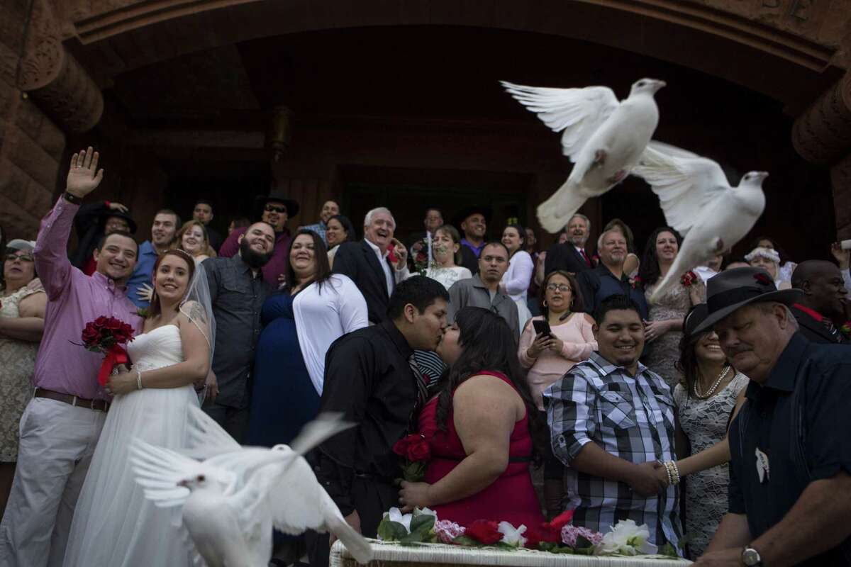 Twenty-five doves were released after one of the free mass wedding ceremonies held annually on the steps of the Bexar County Courthouse on Valentine's Day, Saturday, February 14, 2014. Over 30 couples were married during that ceremony.