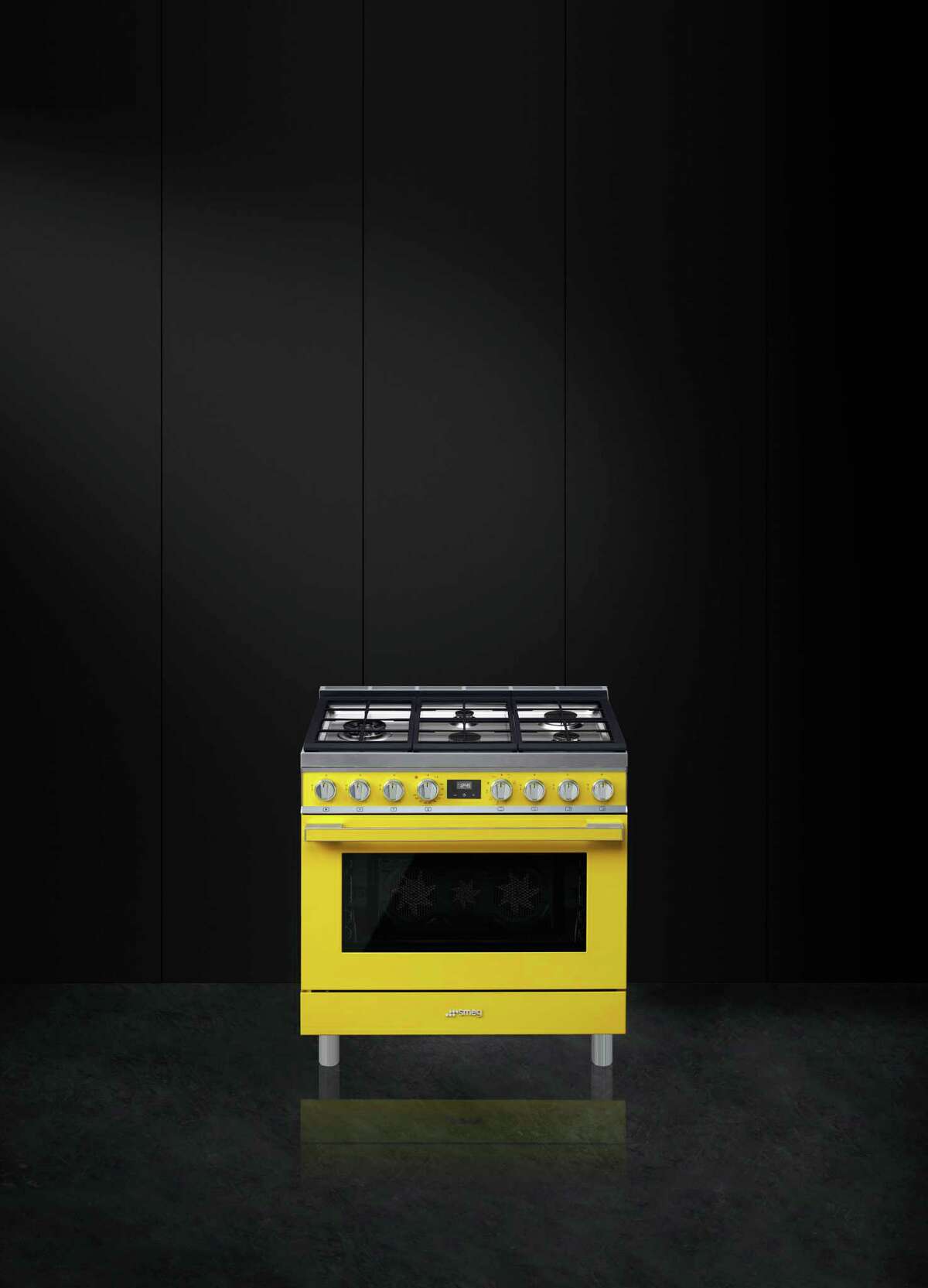 Smeg brand appliances now come in bright colors such as this yellow range. this year they'll launch a liine of matching range hoods that will sell for $3,999 ($3,499 for the stainless steel version).