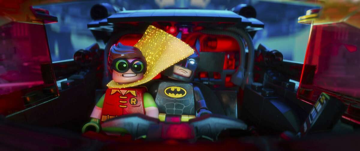 This image released by Warner Bros. Pictures shows Robin, voiced by Michael Cera, left, and Batman, voiced by Will Arnett, in a scene from "The LEGO Batman Movie." (Warner Bros. Pictures via AP)