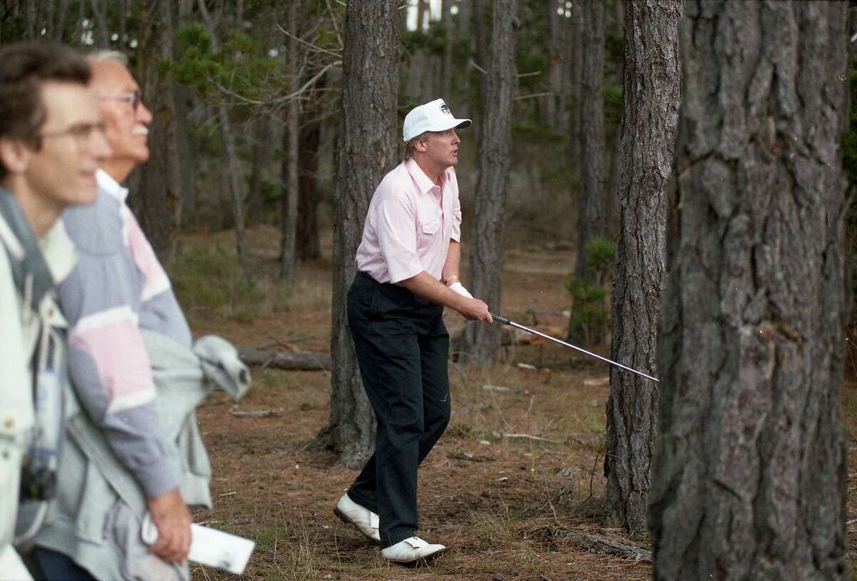 Donald Trump works his way out of the woods during the AT&T Pebble Beach Pro-Am on Feb. 4, 1993 at the Poppy Hills course in Pebble Beach.