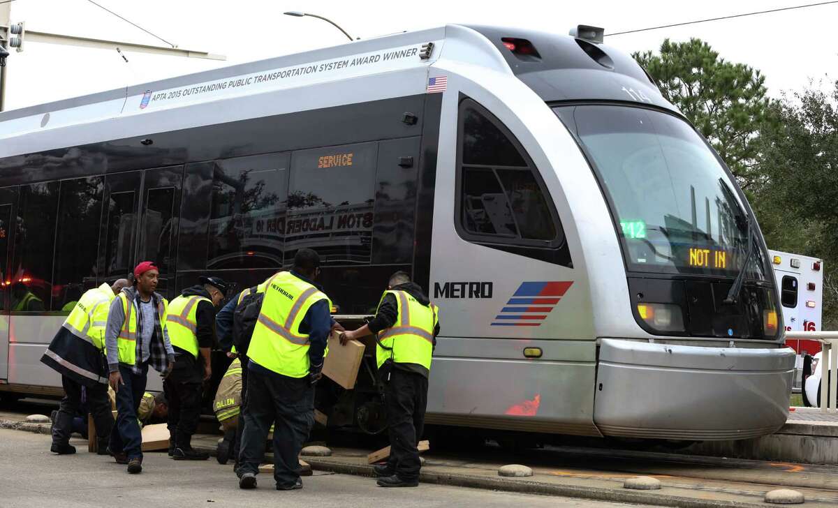 METRO Transit employees work to jack up a METRO Rail that hit and killed a female bicyclist at the intersection of Fannin Street and Sunset Boulevard next to Herman Park on Friday, February 3, in Houston. ( Yi-Chin Lee/ Houston Chronicle)