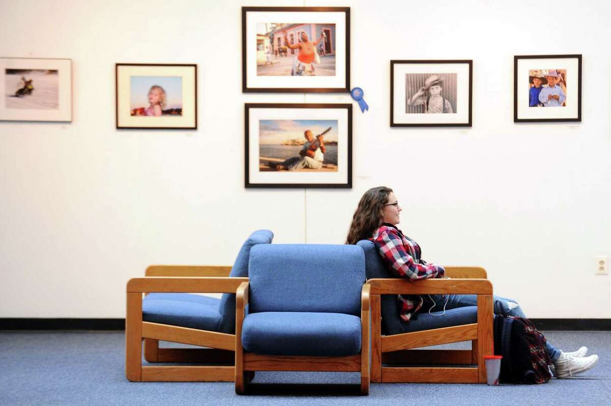 A student sits in the art gallery inside UConn Stamford in Stamford, Conn. on Wednesday, Jan. 25, 2017.
