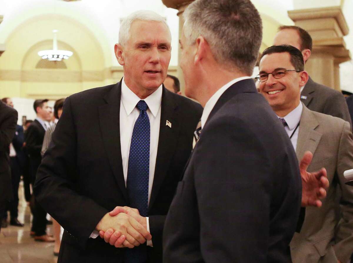 Vice President Mike Pence shakes hands after the Senate voted to confirm Betsy DeVos as education secretary on Capitol Hill on February 7, 2017 in Washington, D.C. The historic 51-50 vote was decided by a tie-breaking vote from Pence.
