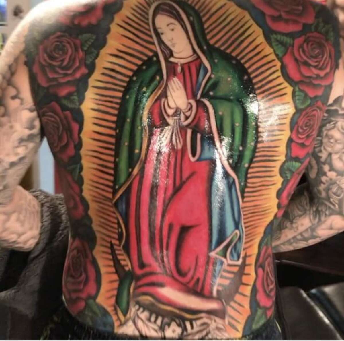 Texas Taboo Tattoo Artist is close to completing a Virgen de Guadalupe piece on the back of his customer Robert.
