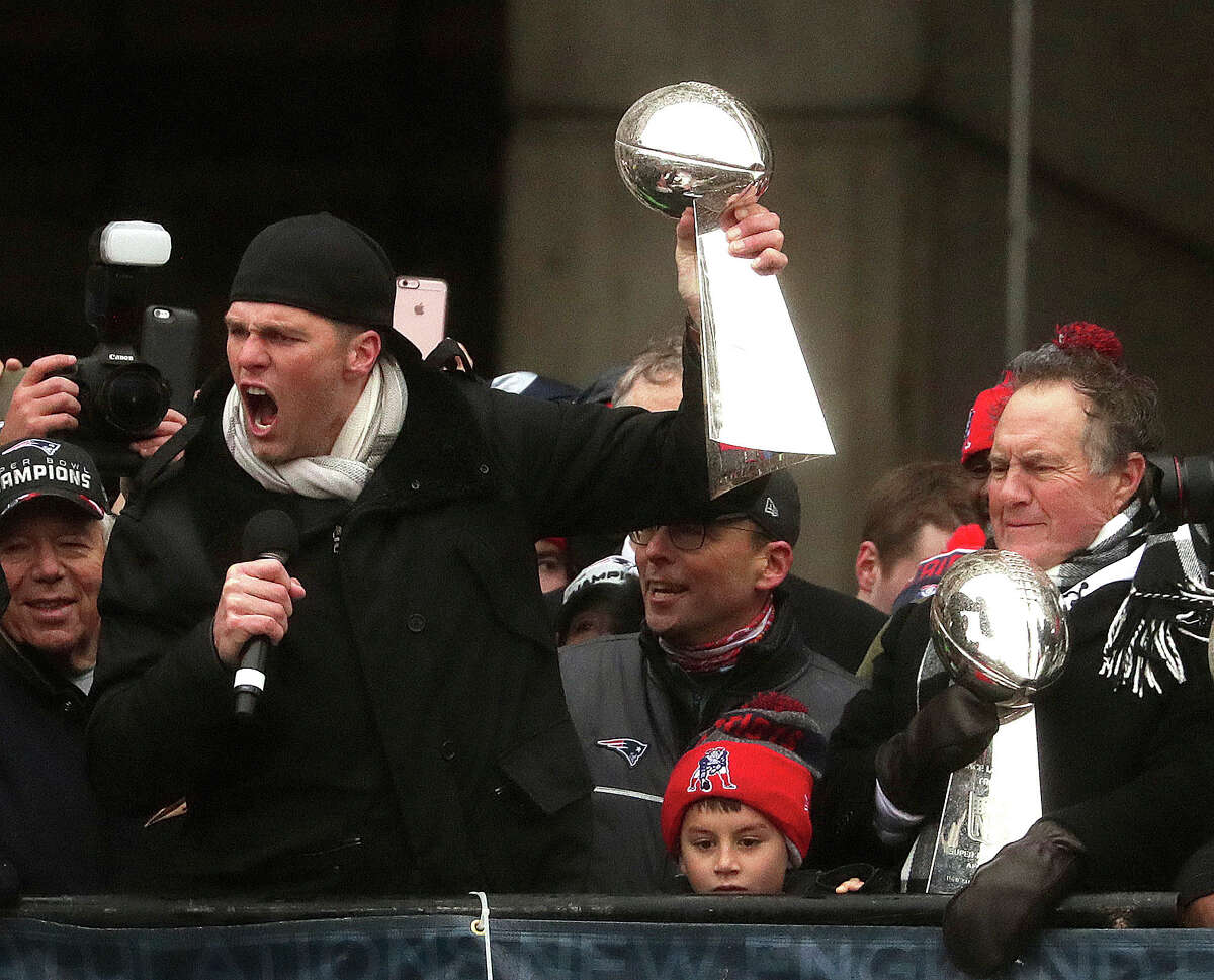 New England Patriots quarterback Tom Brady and head coach Bill Belichick hold Super Bowl trophies during a rally Tuesday, Feb. 7, 2017, in Boston to celebrate Sunday's 34-28 win over the Atlanta Falcons in the NFL Super Bowl 51 football game in Houston. (Barry Chin /The Boston Globe via AP, Pool)