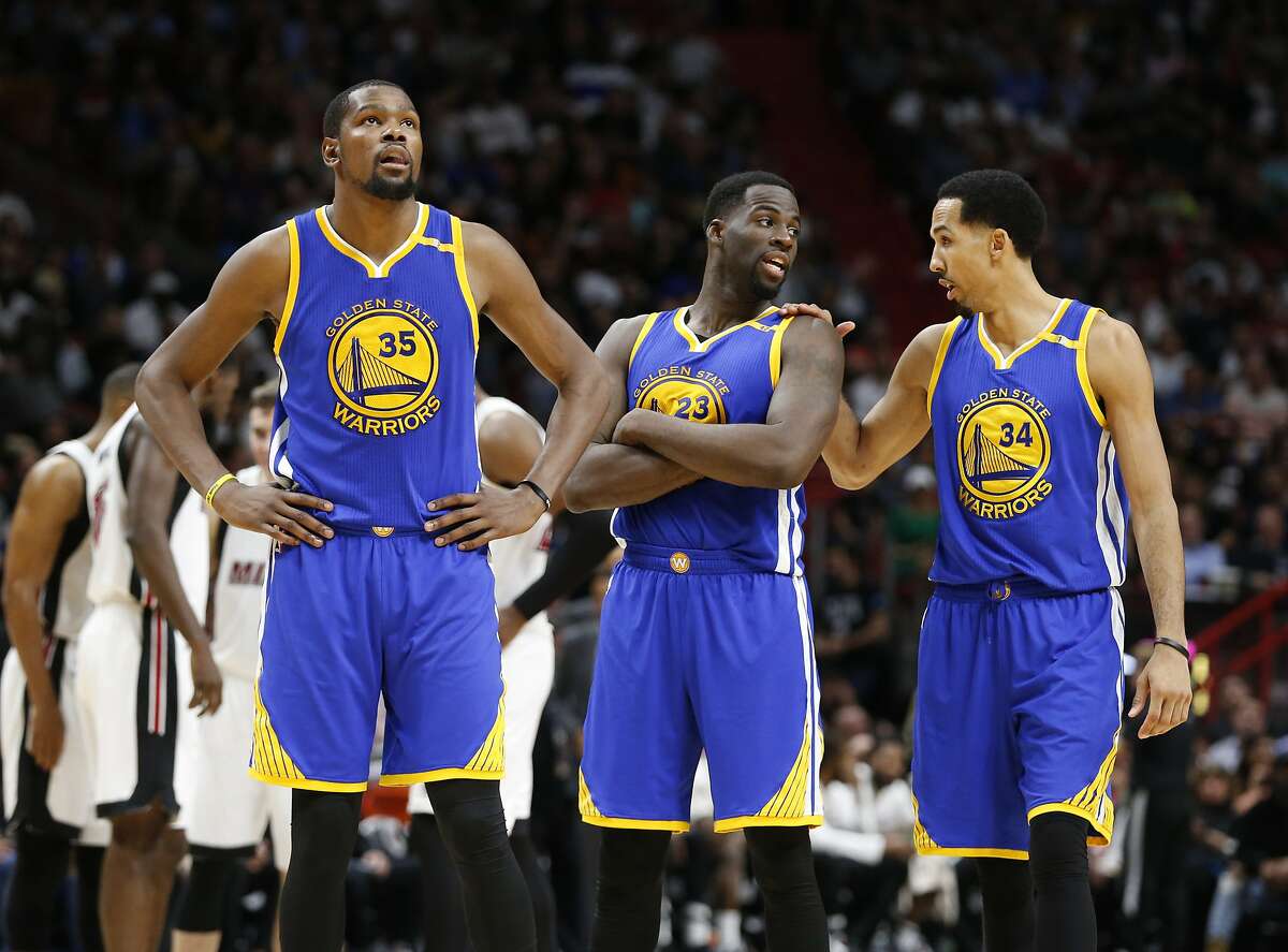 Golden State Warriors forwards Kevin Durant (35) Draymond Green (23) and guard Shaun Livingston (34) are shown during the second half of an NBA basketball game against the Miami Heat, Monday, Jan. 23, 2017, in Miami. The Heat defeated the Warriors 105-102. (AP Photo/Wilfredo Lee)
