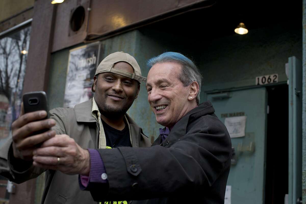 Former San Francisco Supervisor and State Assemblyman Tom Ammiano, right, takes a selfie with Shaibaan Ali, left, at the Marsh Theater in San Francisco, Calif., on Tuesday, February 7, 2017.