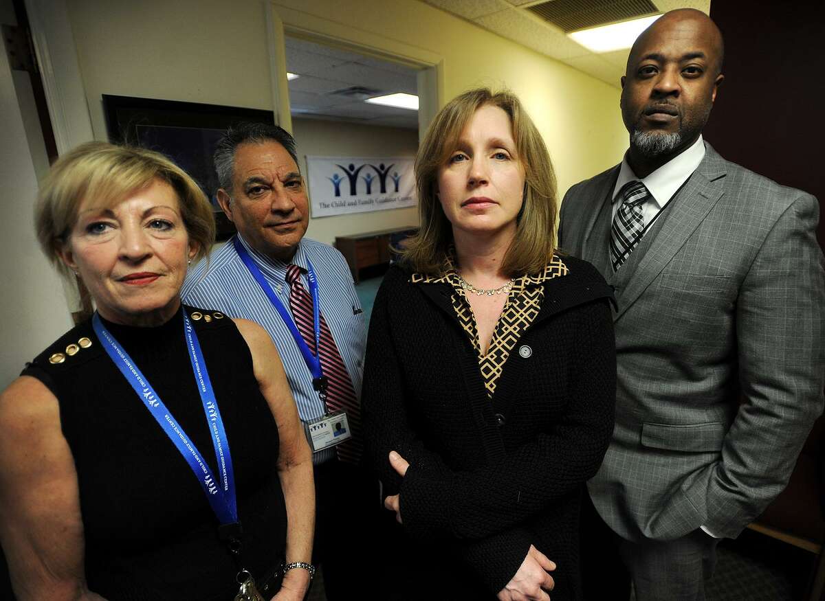 Ann McCarthy, second from right, and her co-workers from left; Irma Camacho, Michael Patota, and Terril Pile, at The Child & Family Guidance Center at 180 Fairfield Avenue in Bridgeport, Conn. on Wednesday, February 8, 2017. The center is a behavioral health outpatient facility for children and families and works with many undocumented city residents. McCarthy, a Fairfield resident photographed for the Connecticut Post at Monday's sanctuary city rally at Bridgeport City Hall, was used as an example by Mayor Joseph Ganim that suburban residents shouldn't involve themselves in city business.