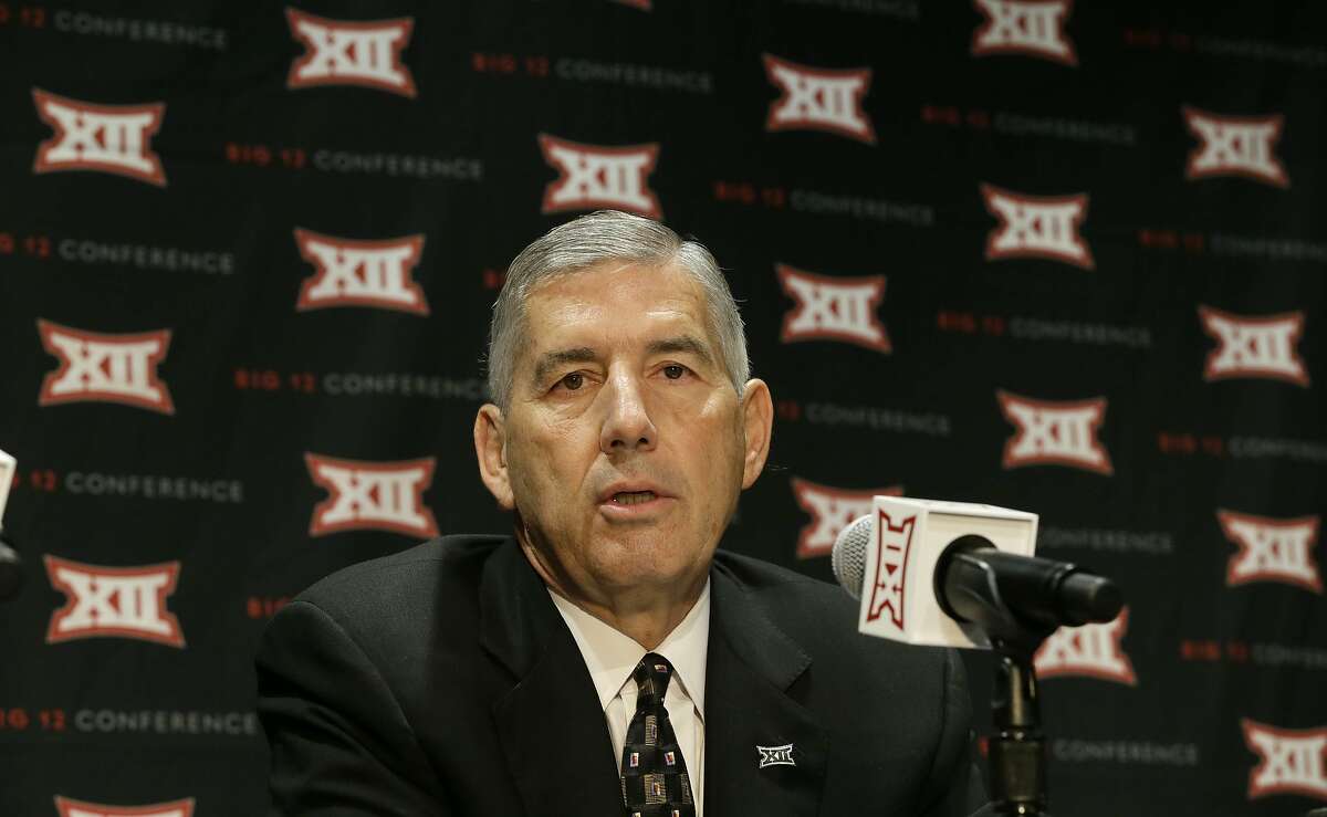 In this Oct. 17, 2016 photo, Big 12 Commissioner Bob Bowlsby speaks to reporters after The Big 12 Conference meeting in Grapevine, Texas. Two years ago, the NCAA passed a proposal that encouraged college football to embrace technology by putting tablet computers on sidelines and cameras in helmets. Two years later, college football is still behind the times when it comes to using technology to coach players during games. (AP Photo/LM Otero)