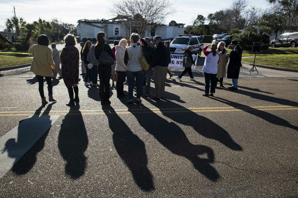 People gather outside the Islamic Center of Victoria before a prayer gathering to show support for the muslim community after the mosque burned in Victoria, Texas on January 29, 2017.