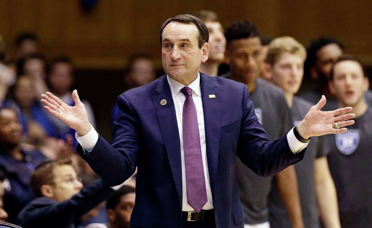 FILE - In this Nov. 29, 2016, file photo,Duke coach Mike Krzyzewski reacts during the second half of an NCAA college basketball game against Michigan State in Durham, N.C. Krzyzewski says he is returning this weekend to coach his Duke Blue Devils. The Hall of Fame coach made the announcement Thursday, Feb. 2, 2017, on his weekly radio show that he will make his return Saturday against Pittsburgh after back surgery kept him out for four weeks.(AP Photo/Gerry Broome, File) ORG XMIT: NY903