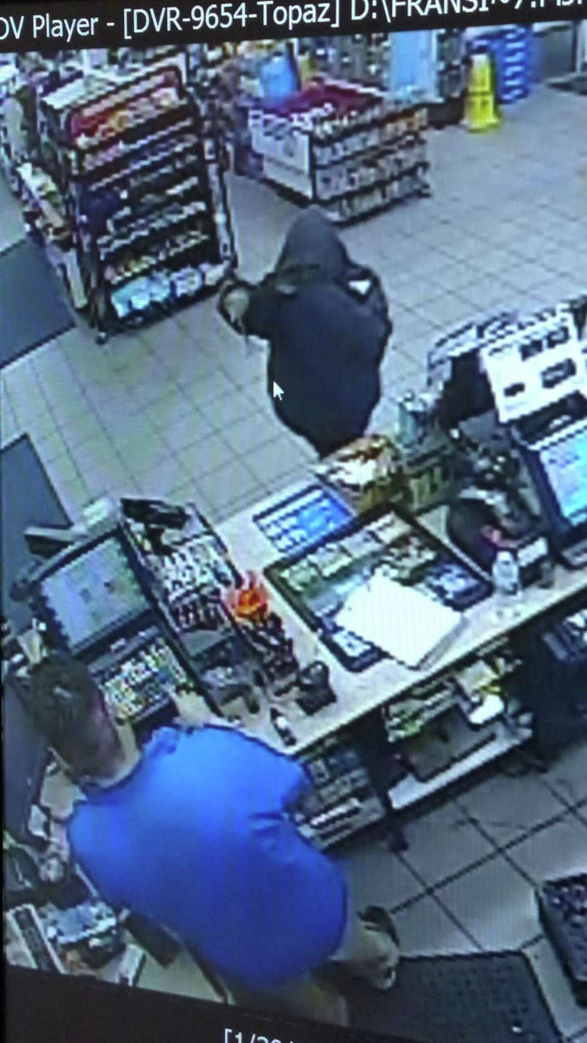 Laredo police said they are looking for the man in dark. He allegedly used a crow bar to threaten the convenience store employee.