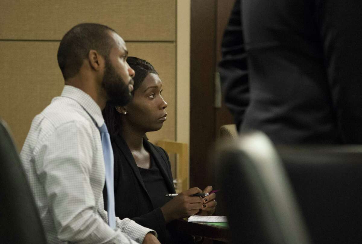 Marquita Johnson, right, and Qwalion Busby sit during their trial on Wednesday, Feb. 8, 2017, in the 290th State District Court in San Antonio. Johnson and Busby are charged with injury to a child, accused of withholding traditional medical treatment from their son, who later died as a result of illness. (Darren Abate/For the San Antonio Express-News)