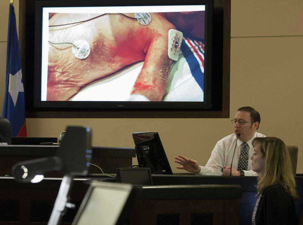 Paramedic Edward Robinson testifies during the trial of Qwalion Busby and Marquita Johnson on Wednesday, Feb. 8, 2017, in the 290th State District Court in San Antonio. Busby and Johnson are charged with injury to a child, accused of withholding traditional medical treatment from their son, who later died as a result of illness. (Darren Abate/For the San Antonio Express-News)