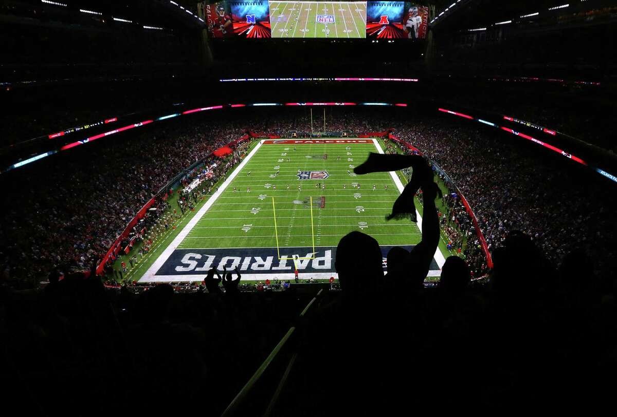A fan waves during the second half of Super Bowl LI at NRG Stadium on Sunday, Feb. 5, 2017, in Houston. ( Jon Shapley / Houston Chronicle )