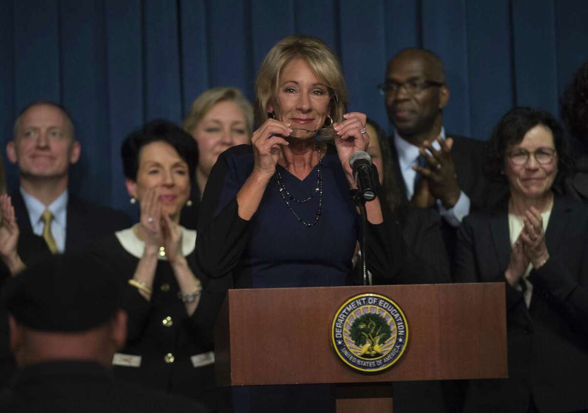 Education Secretary Betsy DeVos is applauded after addressing the department staff at the Department of Education on Wednesday in Washington.