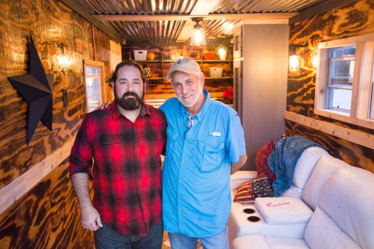 Mark Cook, founder and executive director of Green Zone Housing, right, and Mike Bradford, of Bradford Built Designs, pose for a portrait inside a prototype of the Green Zone homeless veteran housing on Saturday, Dec. 17, 2016, at the Lone Star Community Center in Montgomery.