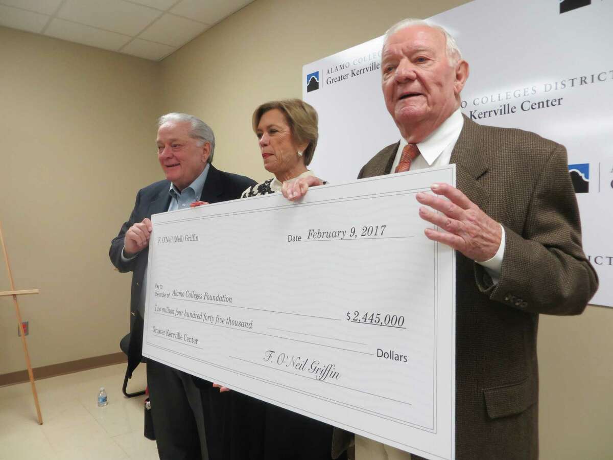 Neil Griffin and his wife, Gena, presented a check for $2.445 million to the Alamo Colleges Foundation at a ceremony in Kerrville on Thursday, Feb. 9, 2017, to benefit the district's regional center in the Hill Country city. Shown left to right are Mike Giffin, Neil's youngest brother; Gena and Neil.