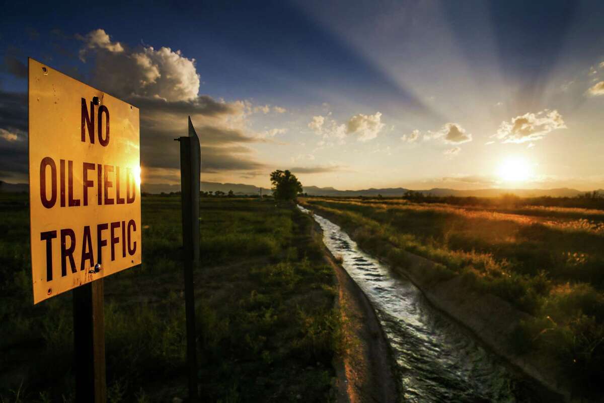 A sign prohibiting oilfield traffic along county road 320 sits next to a canal full of water from the natural spring at Balmorhea State Park Friday, Sept. 16, 2016 in Balmorhea. Houston-based Apache Corporation recently announced the discovery of an estimated 15 billion barrels of oil and gas in the area.