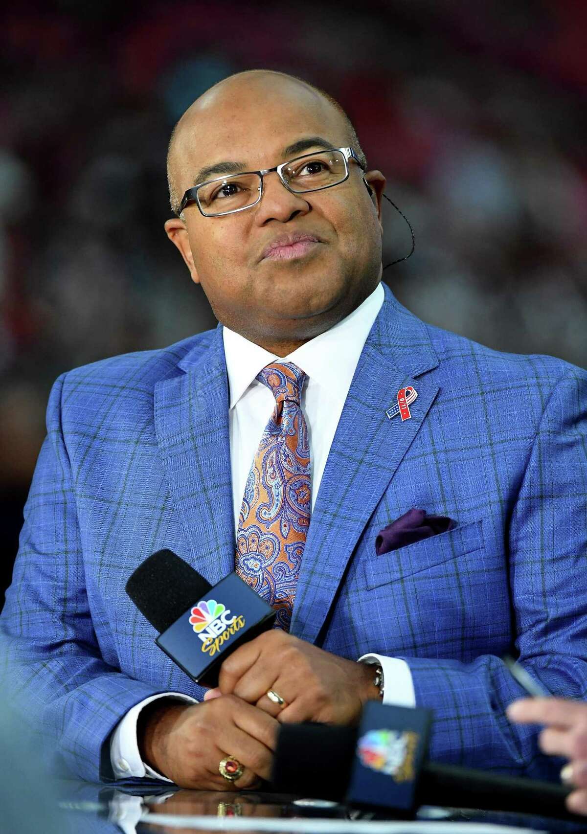 Sportscaster Mike Tirico sits on the Sunday Night Football set before the NFL game between the New England Patriots and the Arizona Cardinals at University of Phoenix Stadium on September 11, 2016 in Glendale, Arizona. New England won 23-21. (Photo by Ethan Miller/Getty Images)