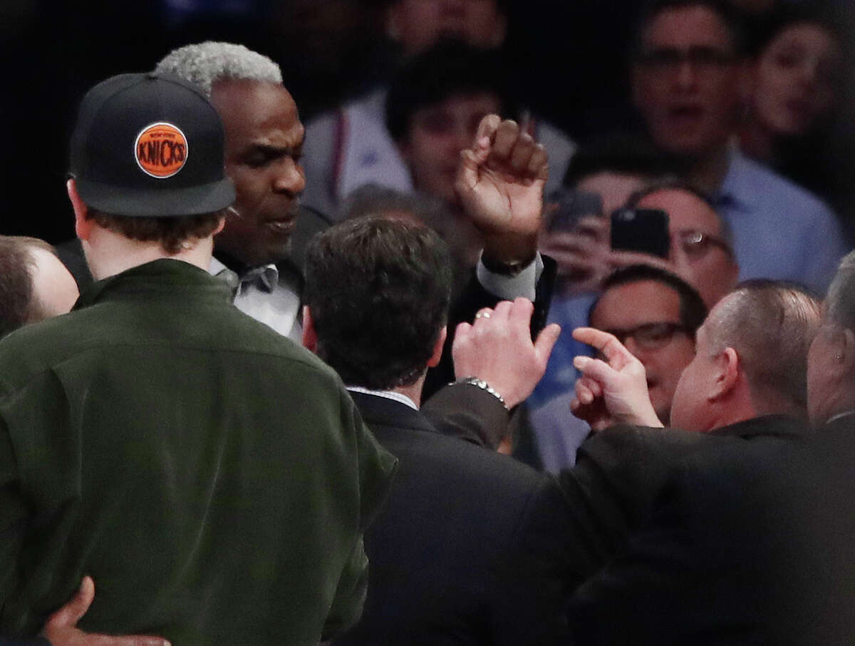 Former New York Knicks player Charles Oakley exchanges words with a security guard during the first half of an NBA basketball game between the New York Knicks and the LA Clippers Wednesday, Feb. 8, 2017, in New York. (AP Photo/Frank Franklin II)