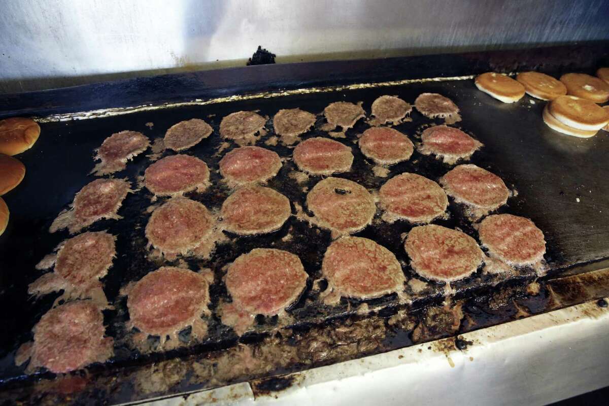 Burgers sizzle as Floyd's Dairy Bar grill. Most will be sold in the restaurant’s well-known 5-for-$4.05 special.