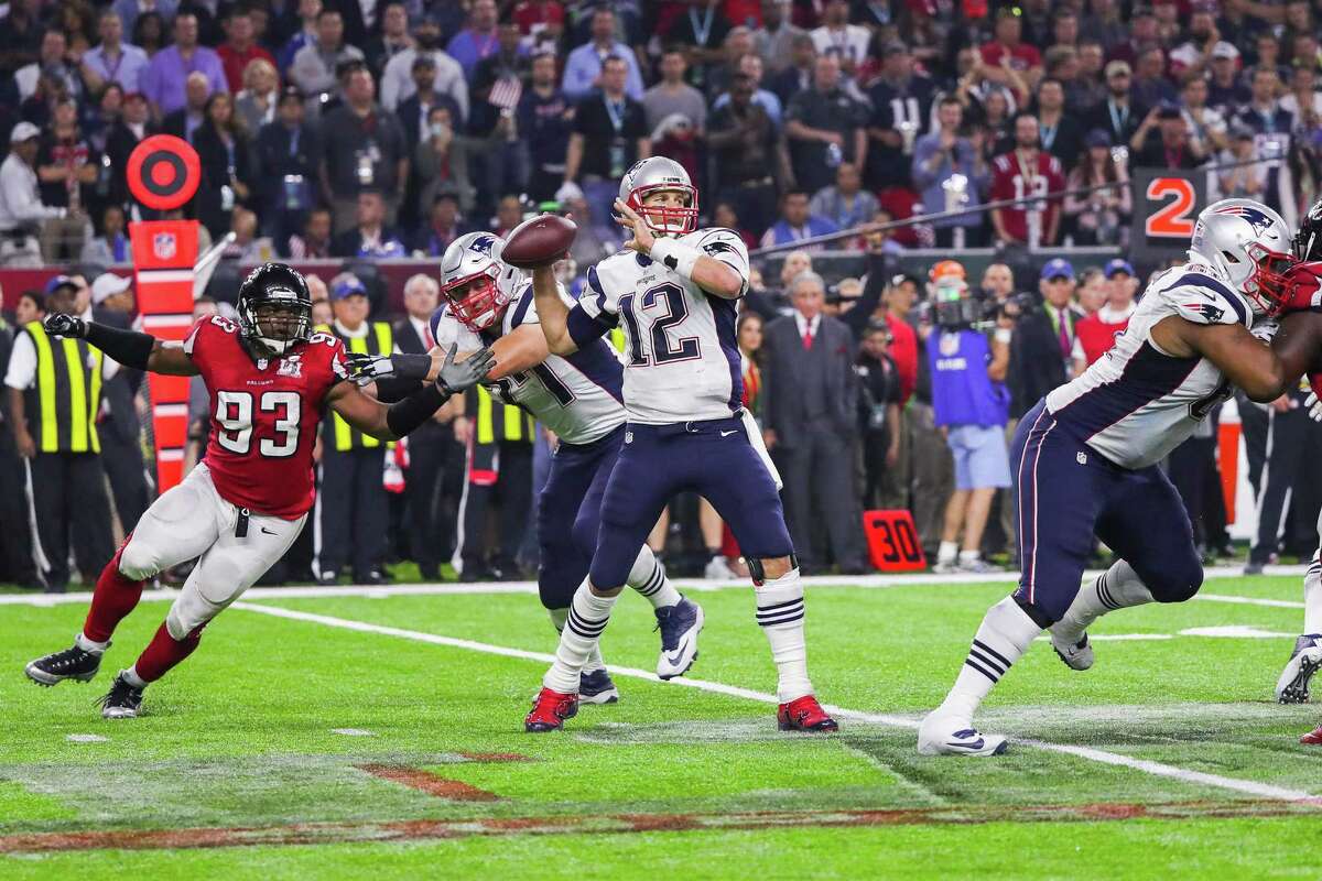 New England quarterback Tom Brady throws a pass on the game-winning drive during overtime of Super Bowl LI against the Atlanta Falcons. A reader claims the Patriots won because of bad calls by the refs.