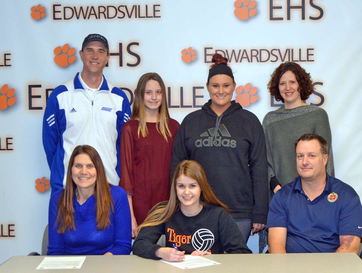 Edwardsville senior Shelbey Saye will play volleyball at John A. Logan College. In the front row, from left to right, are mother Brenda Saye, Shelbey Saye and father Doug Saye. In the back row, left to right, are John A. Logan coach Bill Burnside, sisters Gabby Saye and Camrey Saye and EHS coach Jami Parker.