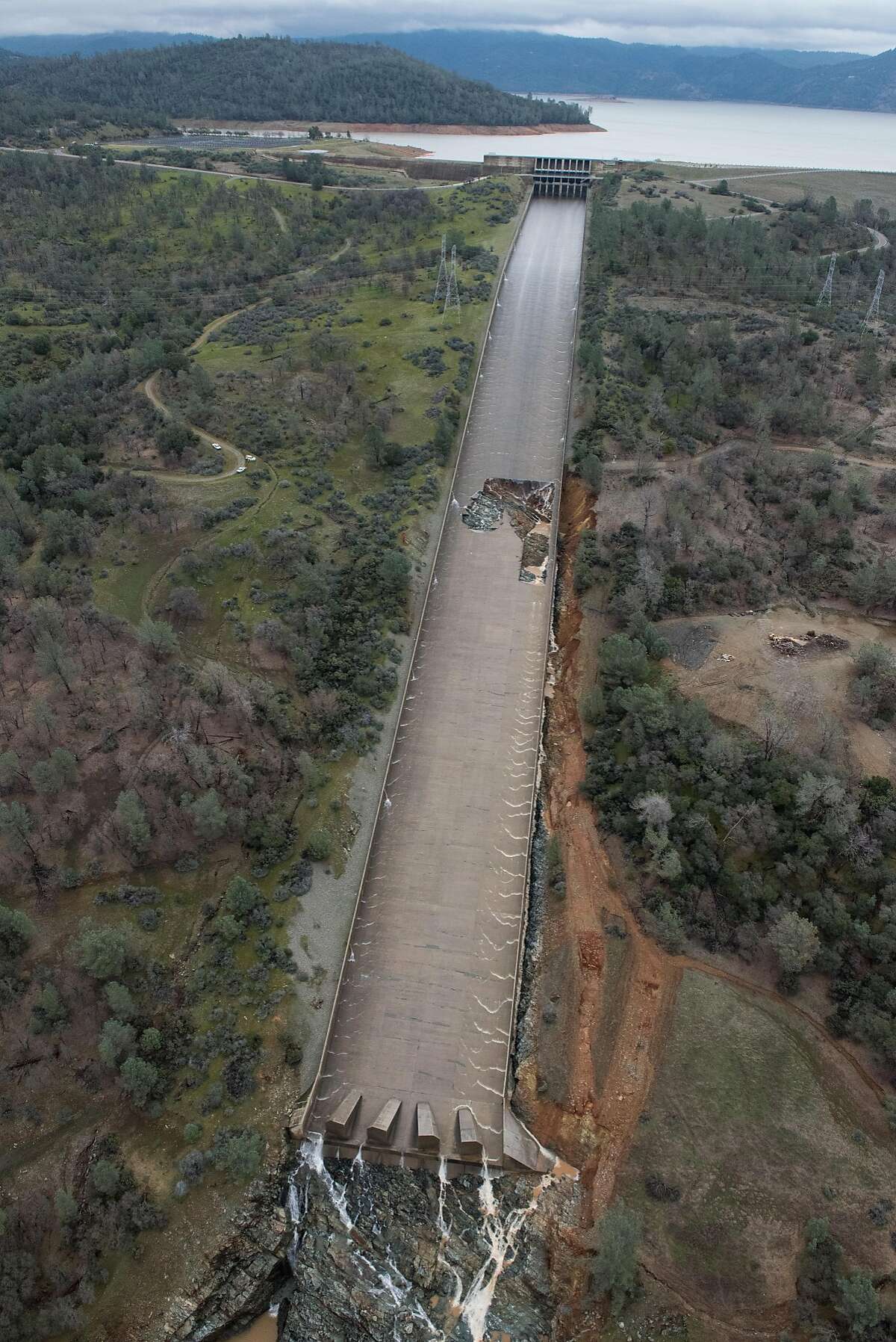 The California Department of Water Resources has suspended flows from the Oroville Dam spillway after a concrete section eroded on the middle section of the spillway. There is no anticipated threat to the dam or the public. DWR engineers are assessing the options to repair the spillway and control the reservoir water level. The Butte County facility is the tallest dam in the United States at 770 feet and is a key part of the State Water Project. Photo taken February 7, 2017. Kelly M. Grow/ California Department of Water Resources