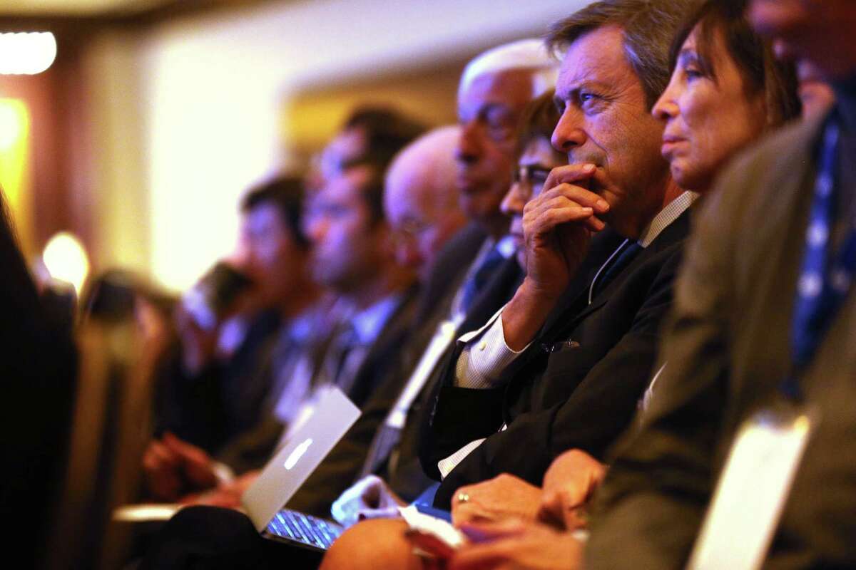 Attendees listen to GE CEO Jeffrey Immelt talks with Dan Yergin,co-founder and chairman of the Cambridge Energy Research Associates, during an Energy & Technology Dialogue at the CERA conference at Hilton Americas on Monday, Feb. 22, 2016, in Houston. ( Elizabeth Conley / Houston Chronicle )