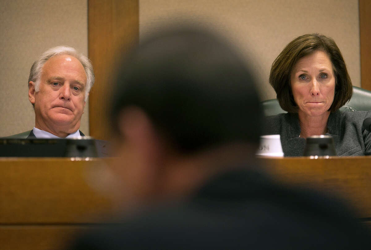Texas Senators Kirk Watson, D-Travis, left, and Lois Kolkhorst, R-Washington, listen to Hank Whitman, Commissioner of the Department of Family and Protective Services, at center back to camera, as he testifies before the Senate of Texas Committee on Health and Human Services during a hearing at the Texas Capitol Thursday, Feb. 2, 2017. Whitman gave an update from his department's yearly critical needs funding and transformation efforts. (Ralph Barrera/Austin American-Statesman via AP)
