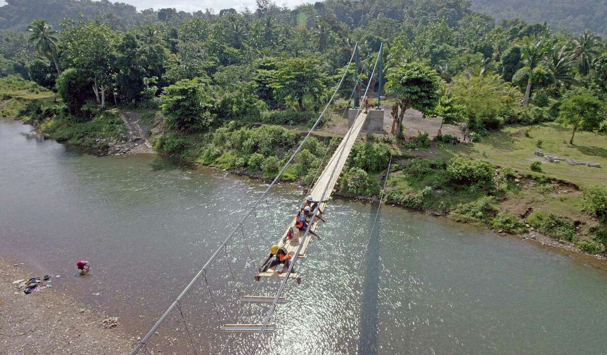 Engineers led by Avery Bang work on the new Chameau footbridge in Haiti, opening a world of opportunity to villagers. It is featured in the IMAX film, “Dream Big: Engineering Our World,” at the Maritime Aquarium at Norwalk.