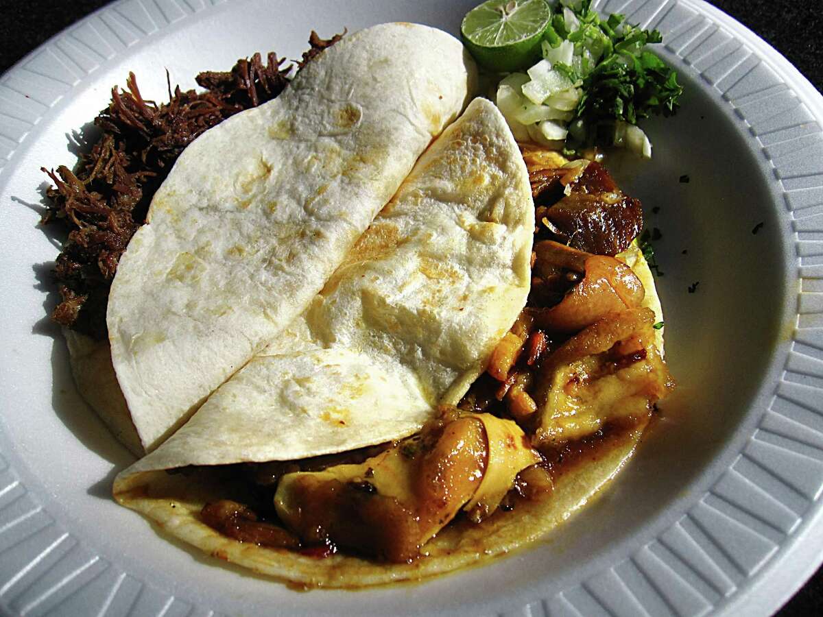 Barbacoa, left, and chicharrones tacos from Mercado Del Pueblo.
