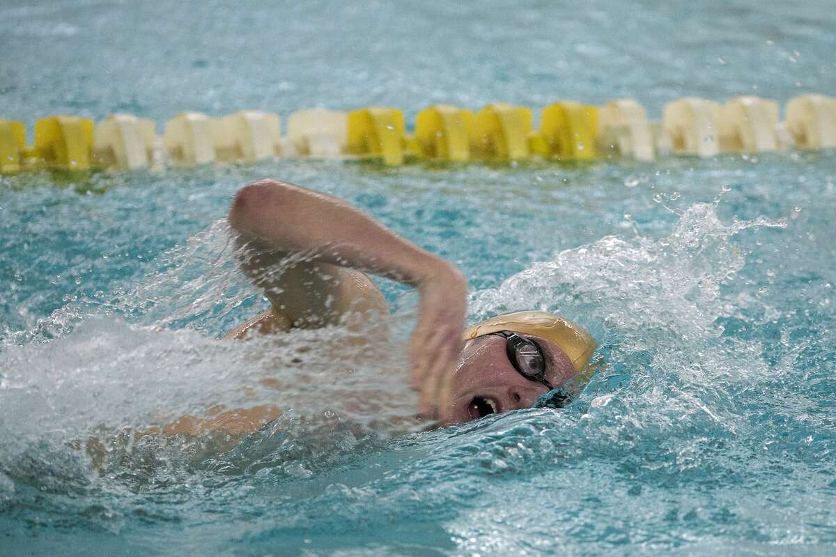 BRITTNEY LOHMILLER | blohmiller@mdn.net Dow High's Noah Behm competes in the 200 yard freestyle swim during a swim meet against Midland High Friday evening. Behm won the 200 free.